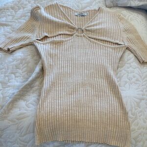Anna Quan Light Beige Ribbed Knit Blouse with Cut Outs.
